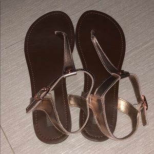 A rose gold girls sandals